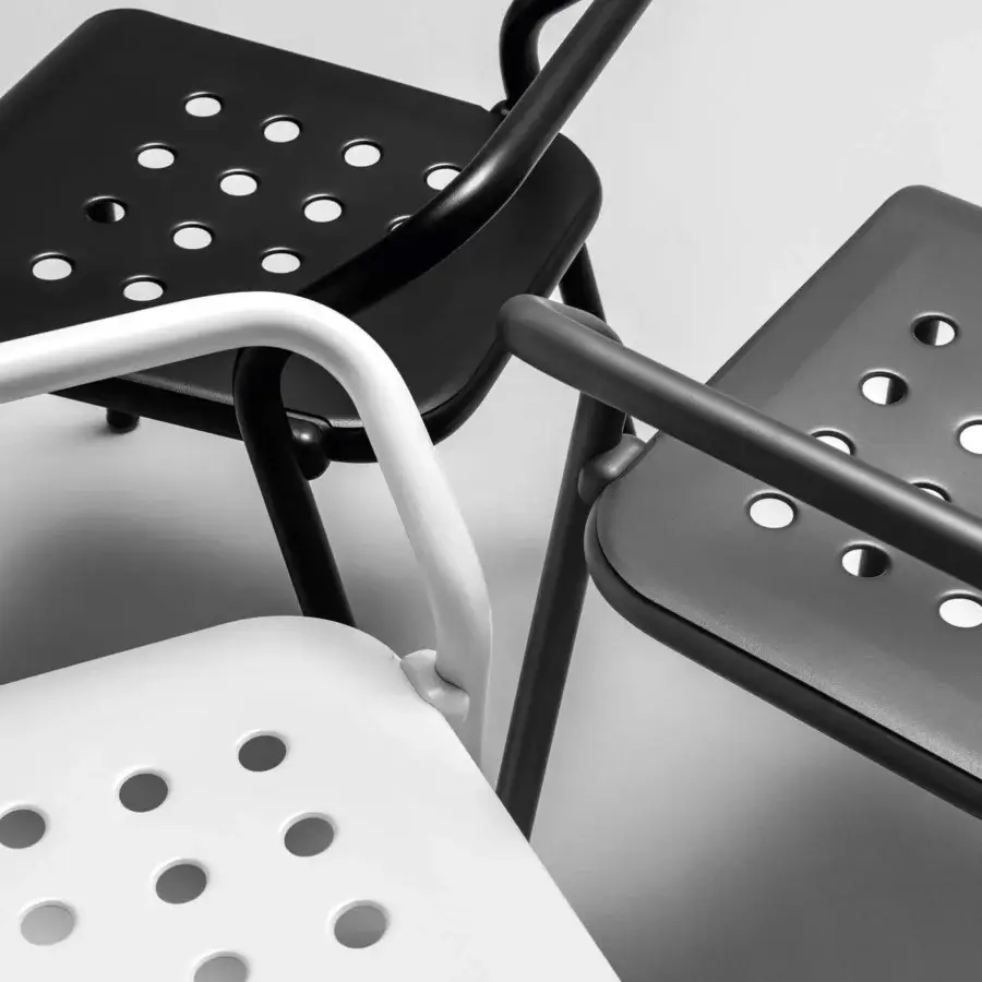Distinctive Varaschin Noss chair crafted in powder-coated aluminum with a sleek matte black finish and perforated seat