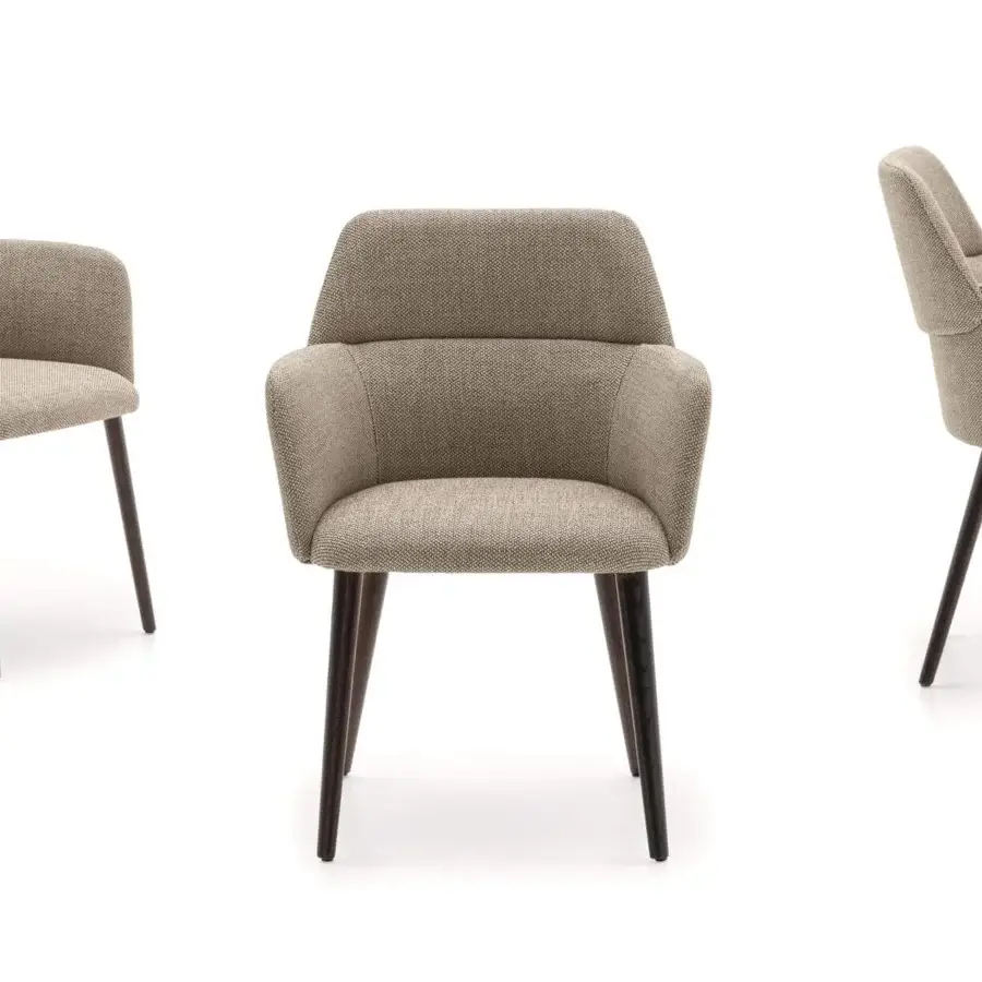 Elegant Ditre Italia Archie armchair with overlapping volumes upholstered in woven beige textile and dark-toned wooden legs