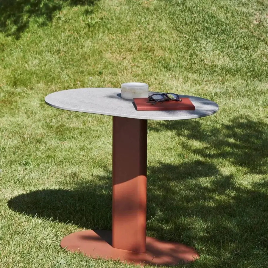 Distinguished Varaschin Plinto side table with elliptical HPL tabletop and cylindrical powder-coated aluminum column built with a steel base