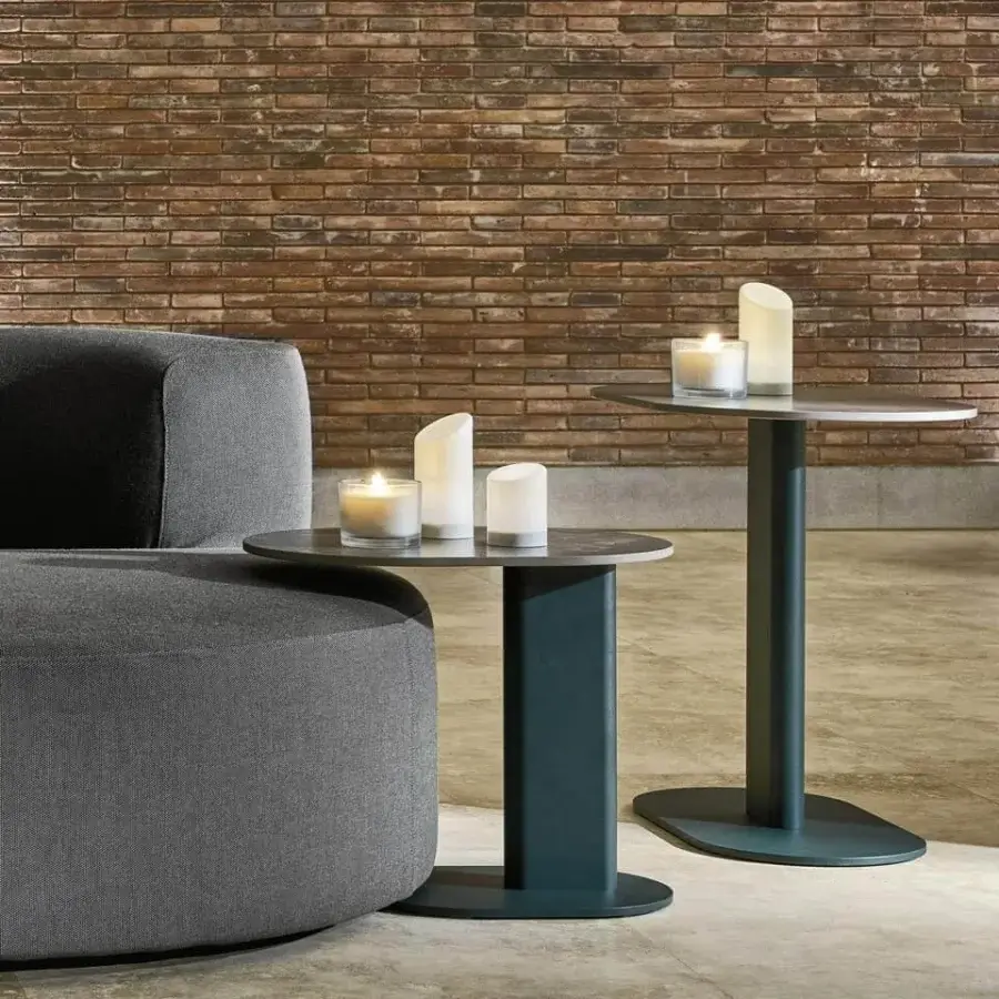 Superior Varaschin Plinto side table with dark teal matte finish and bush-hammered ceramic elliptical top built with aluminum and steel