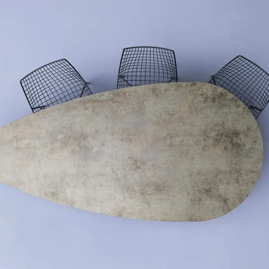 Innovative Varaschin Flexion table with bush-hammered ceramic tabletop and curved powder-coated steel base crafted for marine environments
