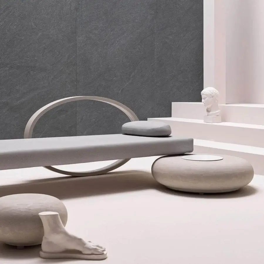 Innovative Varaschin Wellness Therapy bed with light gray textile and smooth matte finish integrating chromotherapy within its stone base