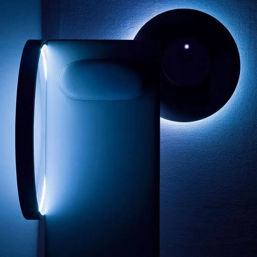 Innovative Varaschin Wellness Therapy bed with blue ambient lighting and a dark circular element offering chromotherapy and music