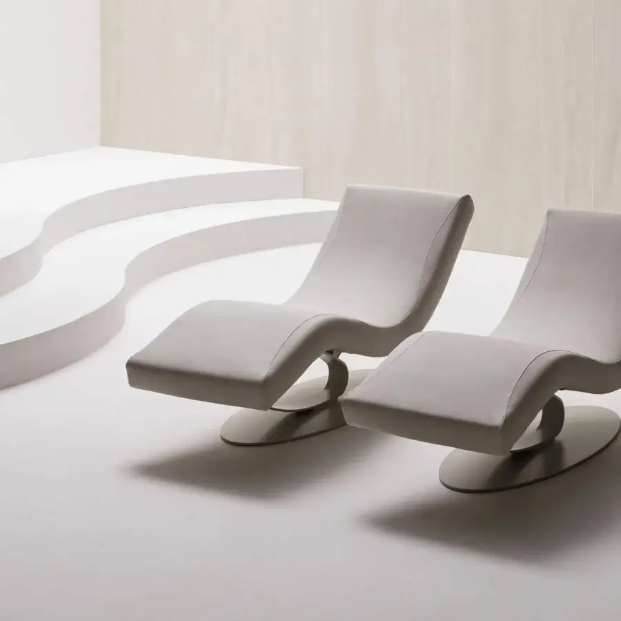 Innovative Varaschin Wellness Therapy lounger in light gray textile with matte finish and curved form