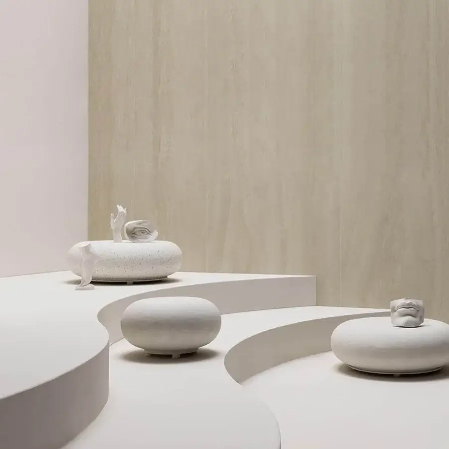 Elegant Varaschin Wellness Therapy stone platform crafted in Italy with a matte white ceramic-like form and stylized sculpture
