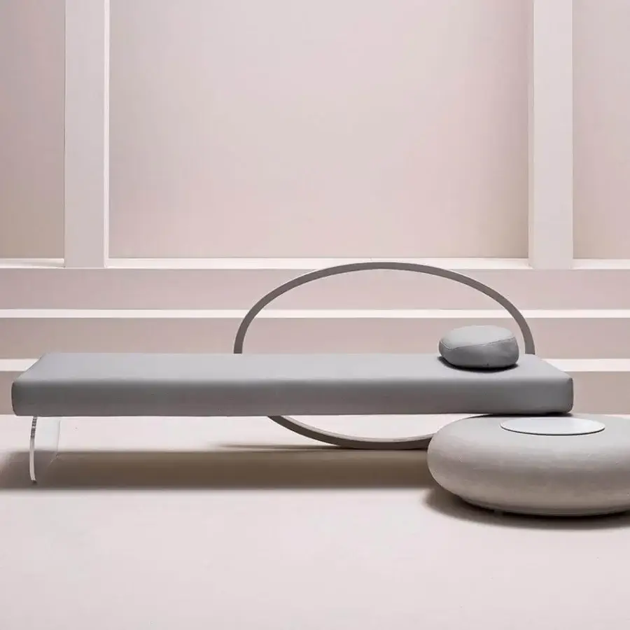 Superior Varaschin Wellness Therapy daybed with grey textile upholstery and transparent plexiglass legs, built with a curved metal accent and Corian touch top