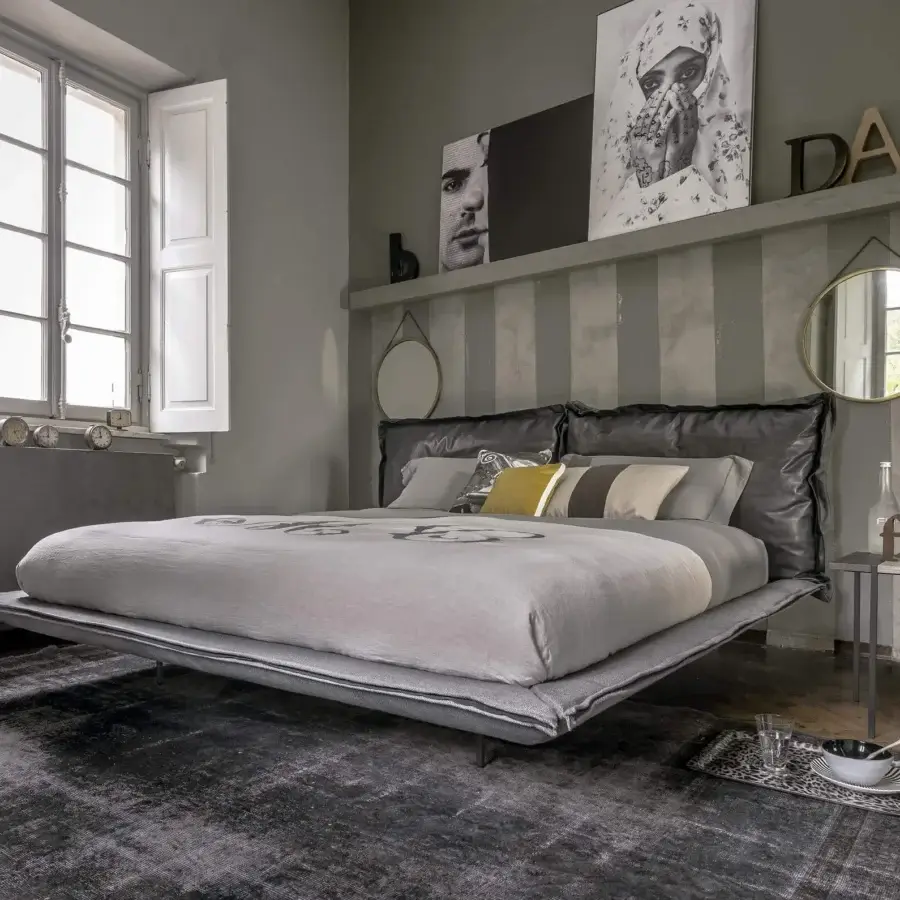 Elegant Arketipo Auto-Reverse Dream bed with muted gray textile and darker gray textured headboard crafted in leather or synthetic material