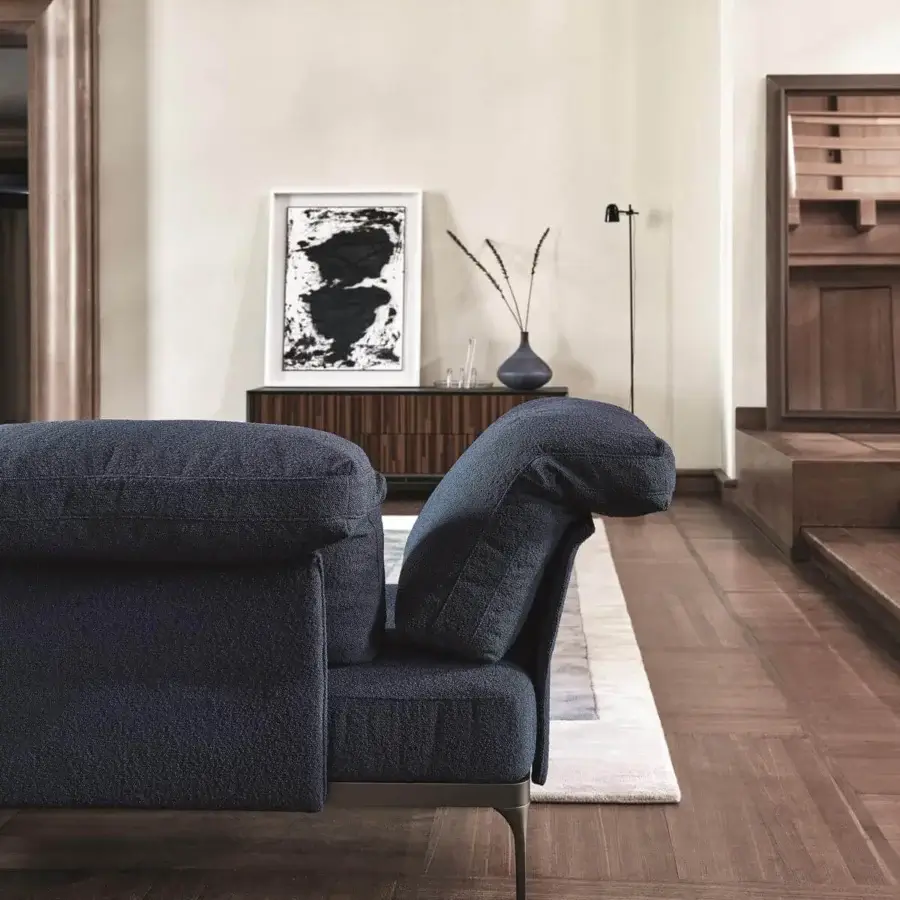 Innovative Ditre Italia Ada sectional with fluid forms upholstered in textured navy-blue textile and slender stiletto-inspired legs