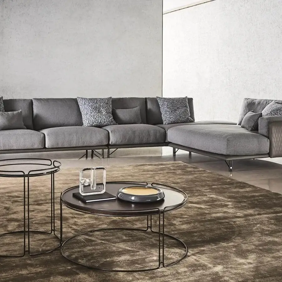 Distinguished Ditre Italia Monolith coffee table with a circular dark tabletop and sleek black metal legs in a matte finish
