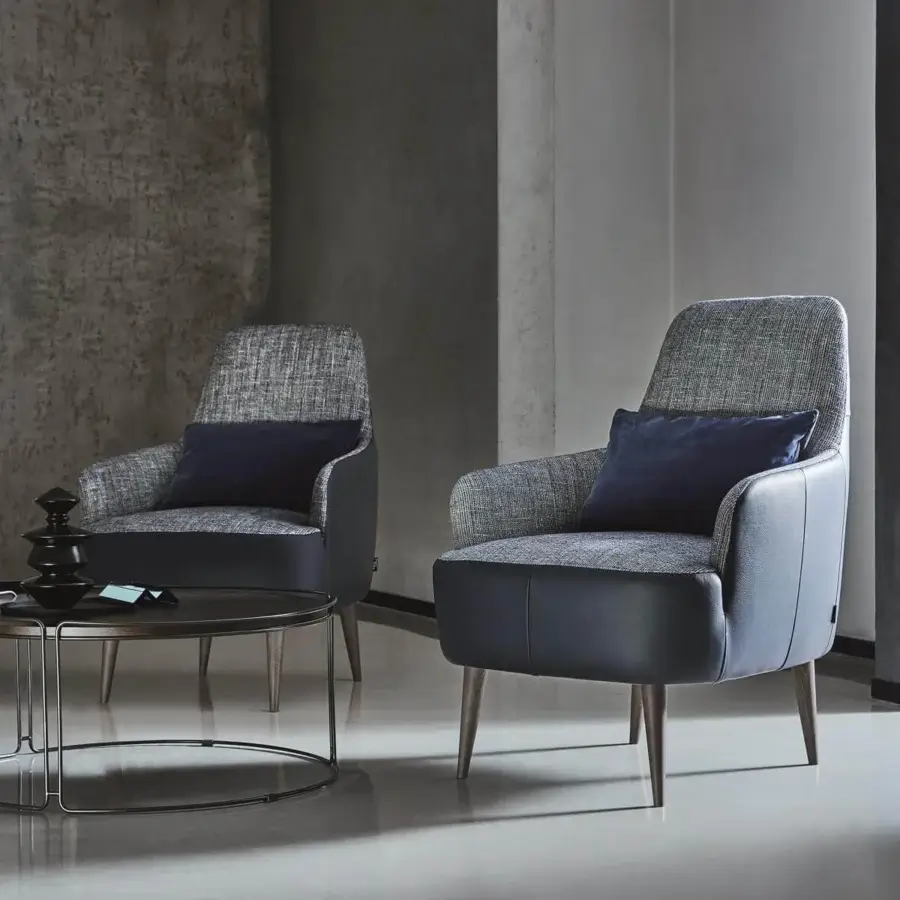 Distinguished Ditre Italia Ray lounge chair with textured gray textile and smooth matte synthetic material sections, supported by natural wood legs