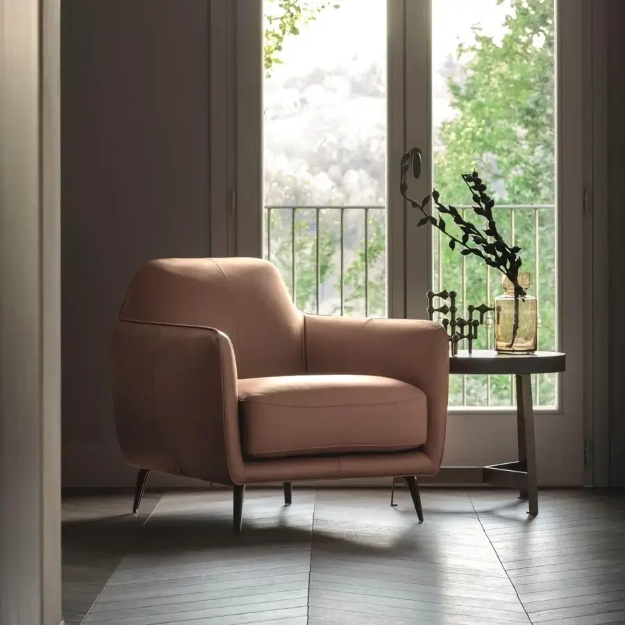 Harmonious Ditre Italia Ellie lounge chair in light brown textile with dark pressure die-cast feet brings Italian contemporary style