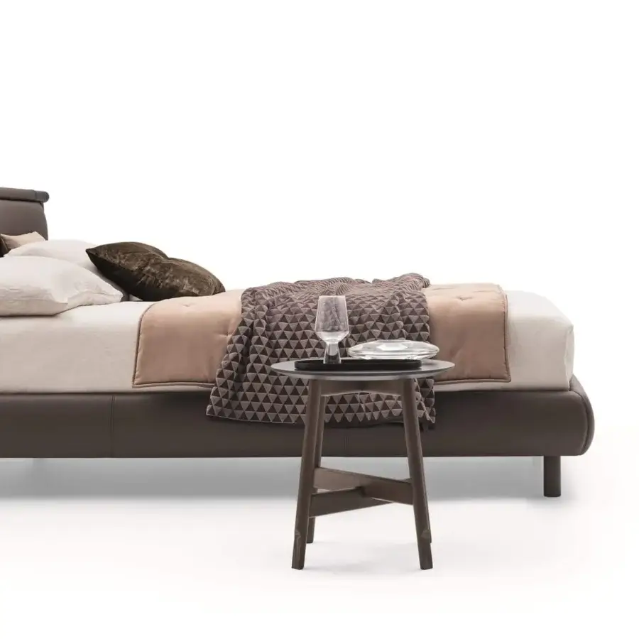 Exclusive Ditre Italia Nathan bed with dark brown leather headboard and a wooden structure offering comfortable cushions