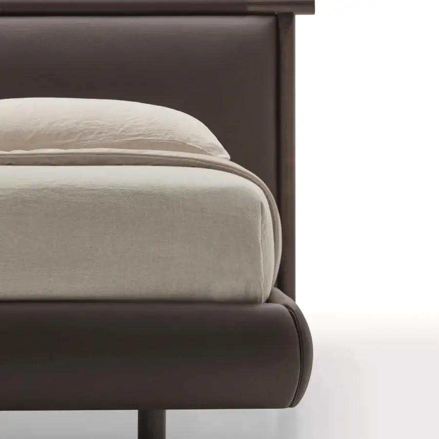 Superior Ditre Italia Nathan bed with dark brown wooden structure and sleek leather headboard complemented with light beige textile bedding