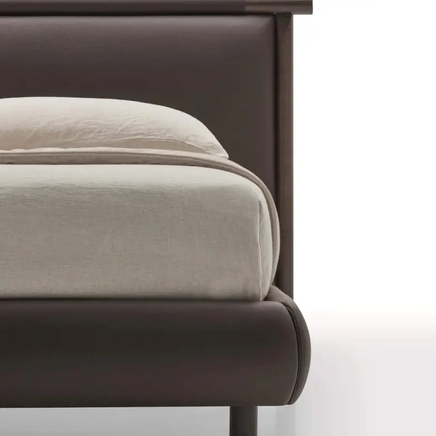 Elegant Ditre Italia Nathan bed with dark brown upholstery and cylindrical wooden legs crafted in Italy