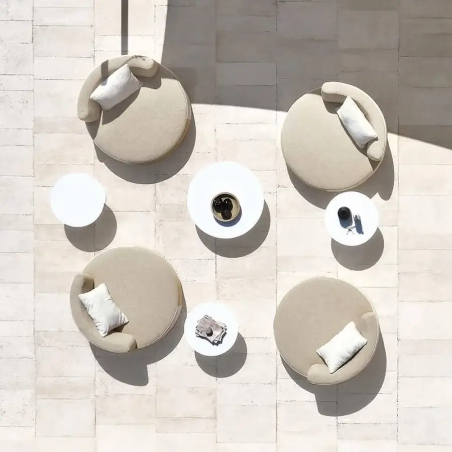 Sophisticated Varaschin Belt lounge chair with fully upholstered design and open-cell draining rubber cushioning in matte beige textile