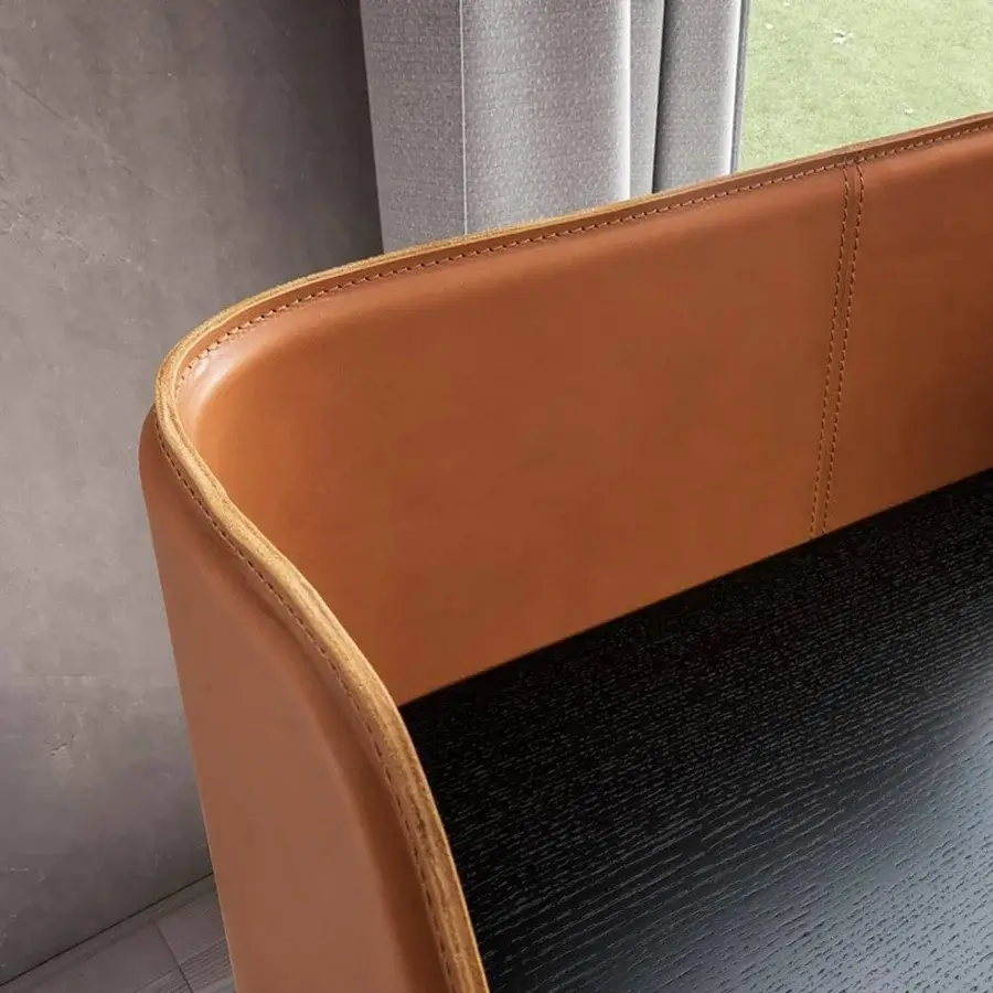 Elegant Presotto Squid desk with black epoxy base and refined wood top in dark finish with light brown leather guard