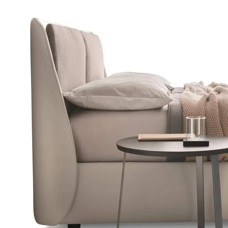 Exceptional Ditre Italia Bend bed with light beige upholstery, cushioned headrests and sleek dark legs