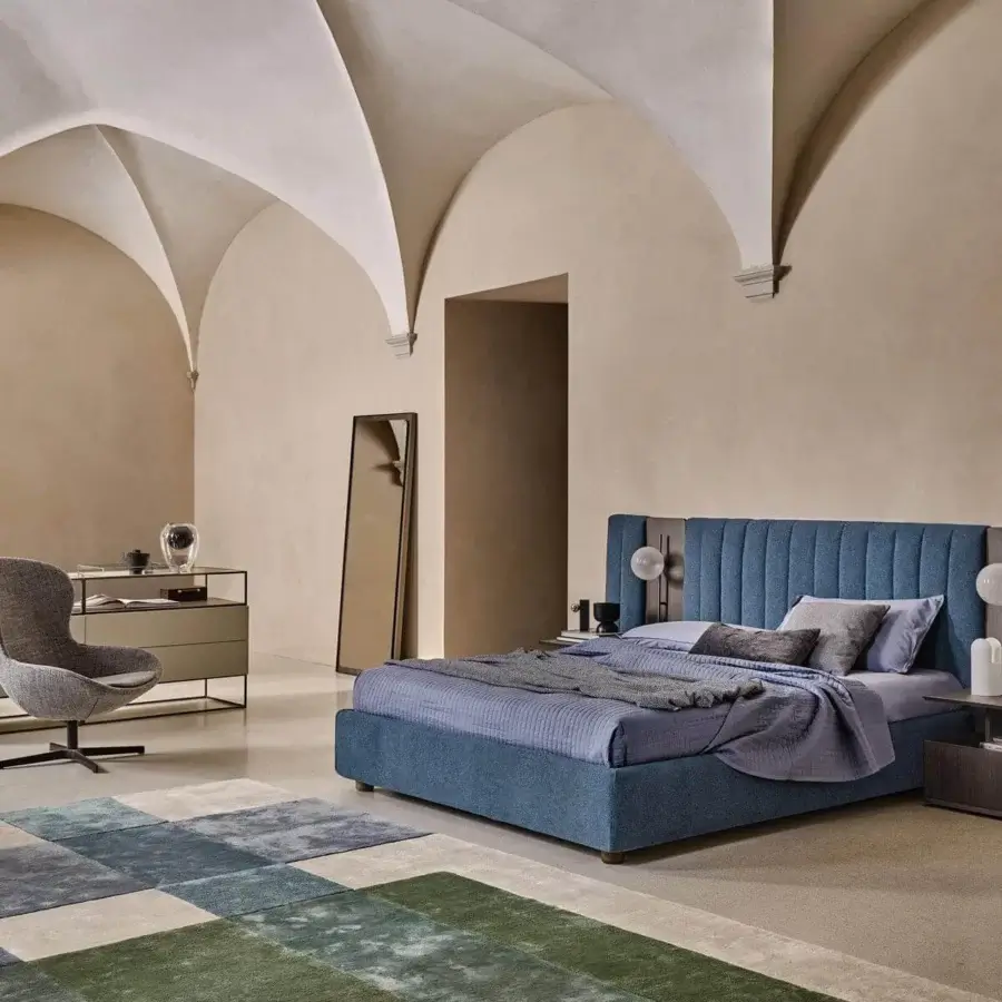 Sophisticated Ditre Italia Round lounge chair with wraparound shape and stylish wooden base in serene blue textile