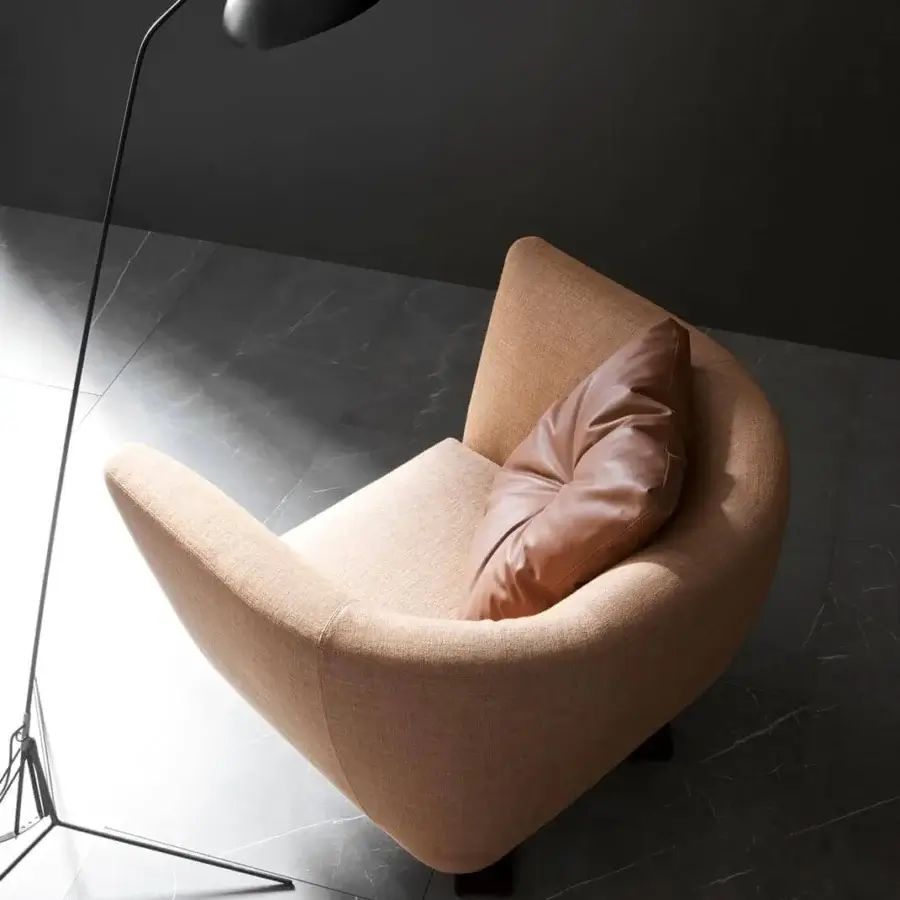 Exceptional Presotto Saint Barth lounge chair with enveloping form upholstered in textured light brown textile and brown leather cushion with Peltro finish