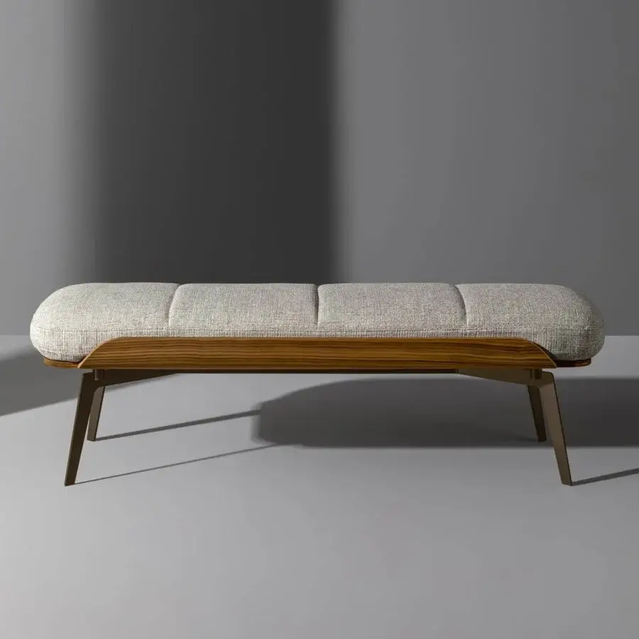 Elegant Bonaldo Olos bench with woven light padding and curved Canaletto Walnut wood detail built with bronze metal legs