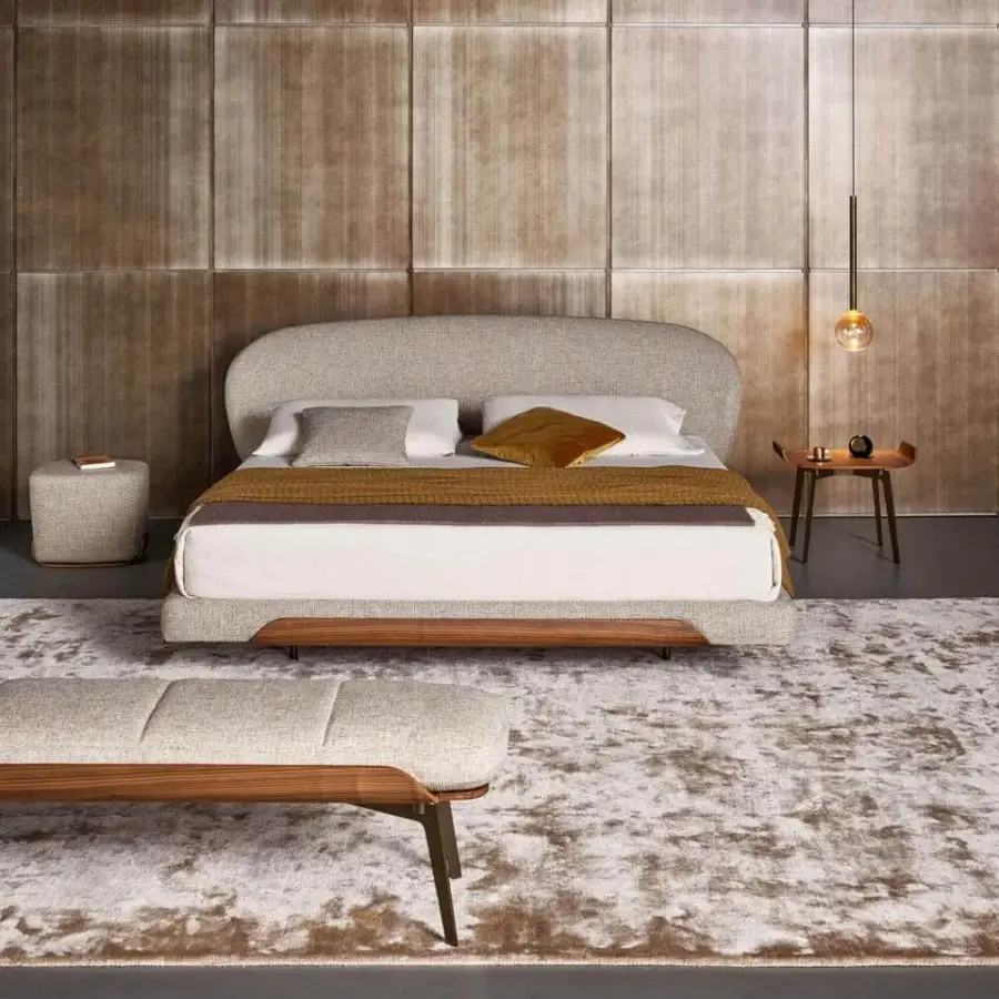 Distinguished Bonaldo Olos nightstand with a curved wood top and slender metal legs in a smooth medium-toned brown finish