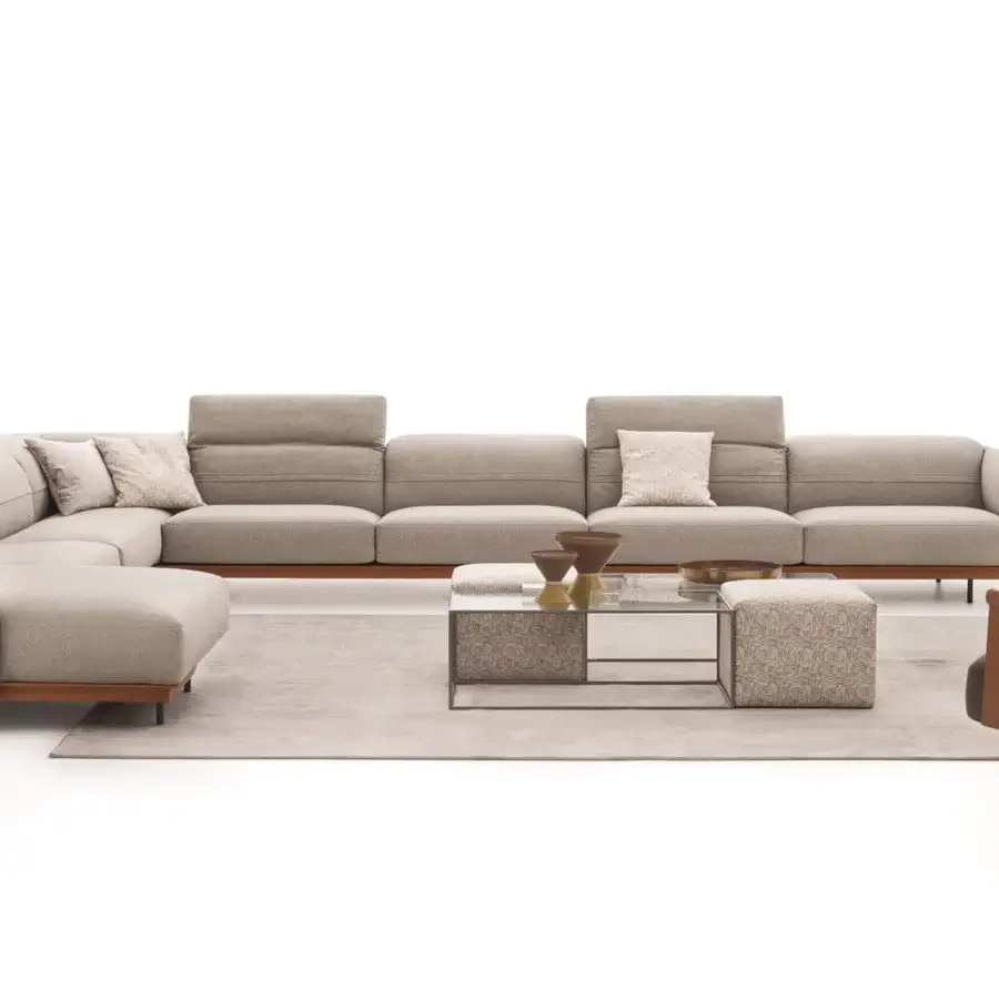 Distinguished Ditre Italia Beyl lounge chair with a rounded backrest and refined leather armrests in light beige textile with a sleek wooden base