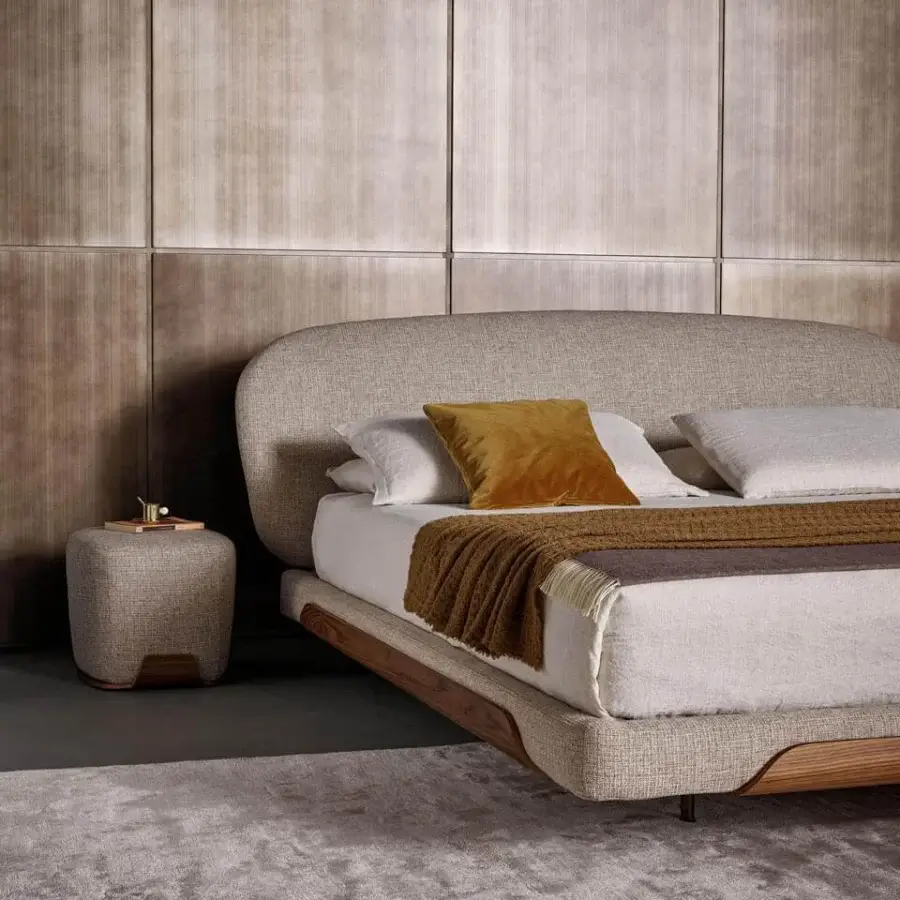 Superior Bonaldo Olos bed crafted in textured beige and light brown textile with curved Canaletto Walnut wood accents and matt varnished metal legs