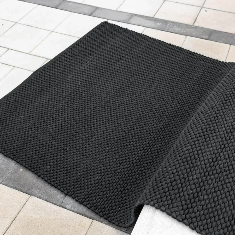 Sophisticated Bonaldo Dakar rug crafted in Italy with wool and polyester in a uniform dark tone and matte finish