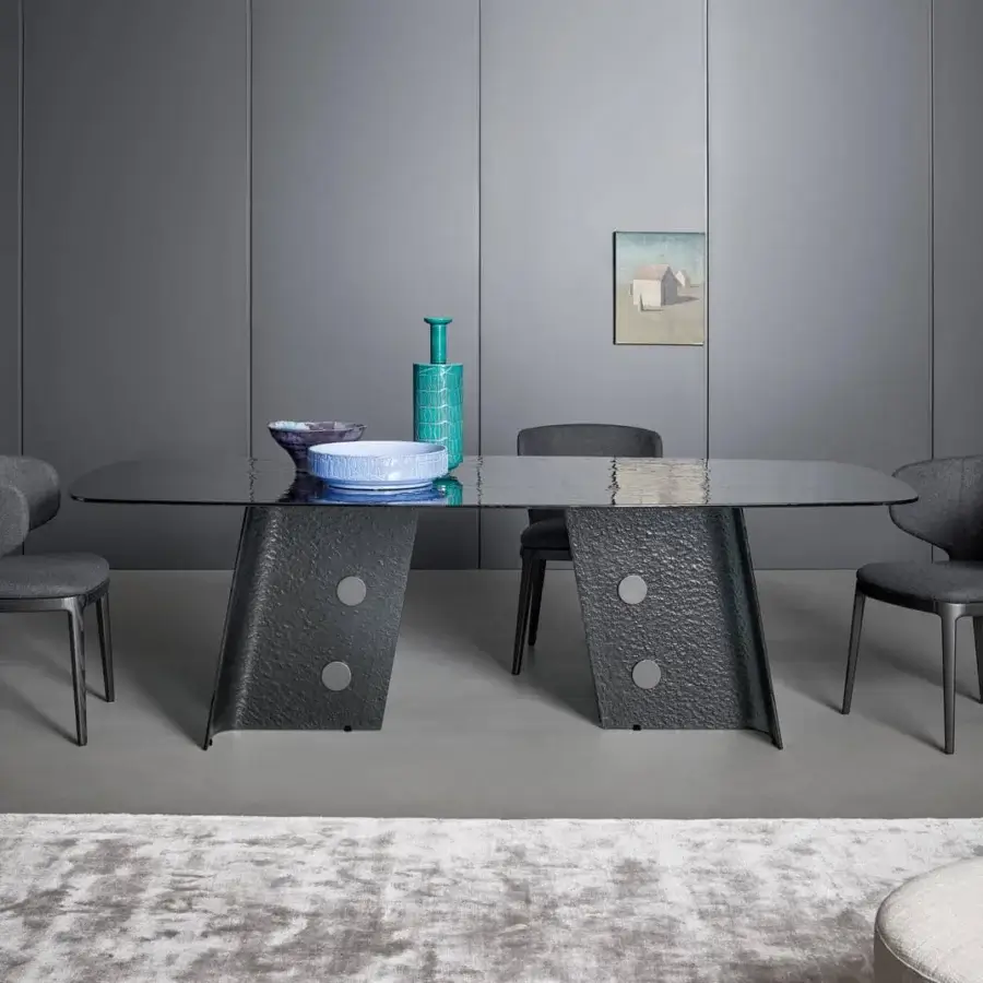 Distinguished Bonaldo Botón table with a glossy dark smoked tempered cast glass top and lead plus metal base