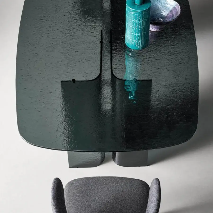 Elegant Bonaldo Botón table with a rounded rectangular top and sleek smoked tempered cast glass construction crafted with glass strips and metal inserts