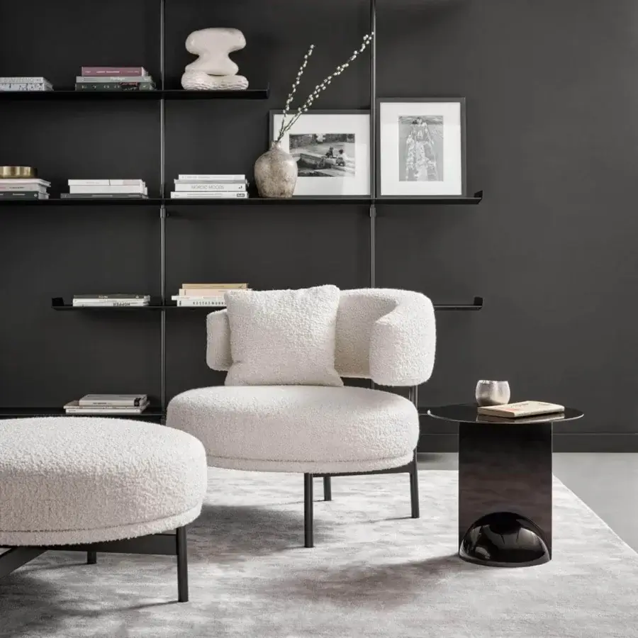 Superior Bonaldo Neuilly lounge chair with enveloping form upholstered in textured light beige textile and slender black metal legs