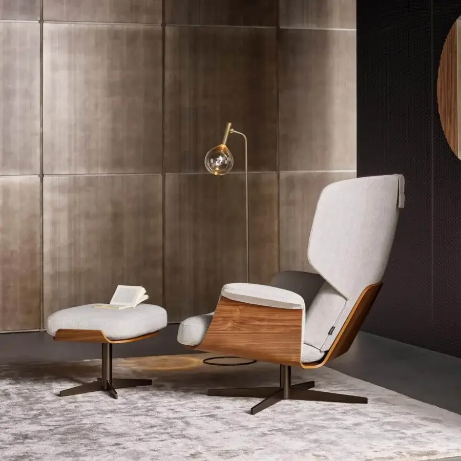 Sophisticated Bonaldo Olos lounge chair with light gray textile upholstery and curved Canaletto Walnut wood structure