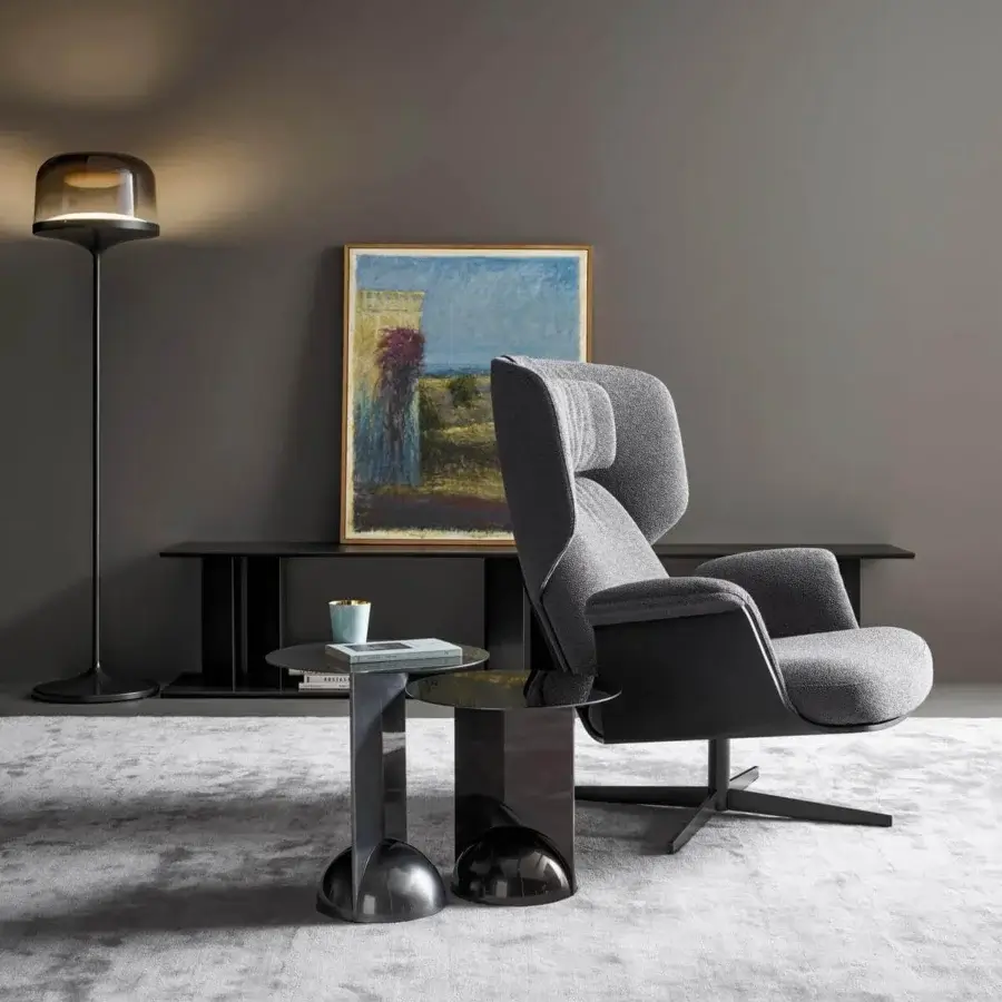 Lavish Bonaldo Olos lounge chair with a curved coal oak structure and soft gray textile upholstery in a matt painted metal finish