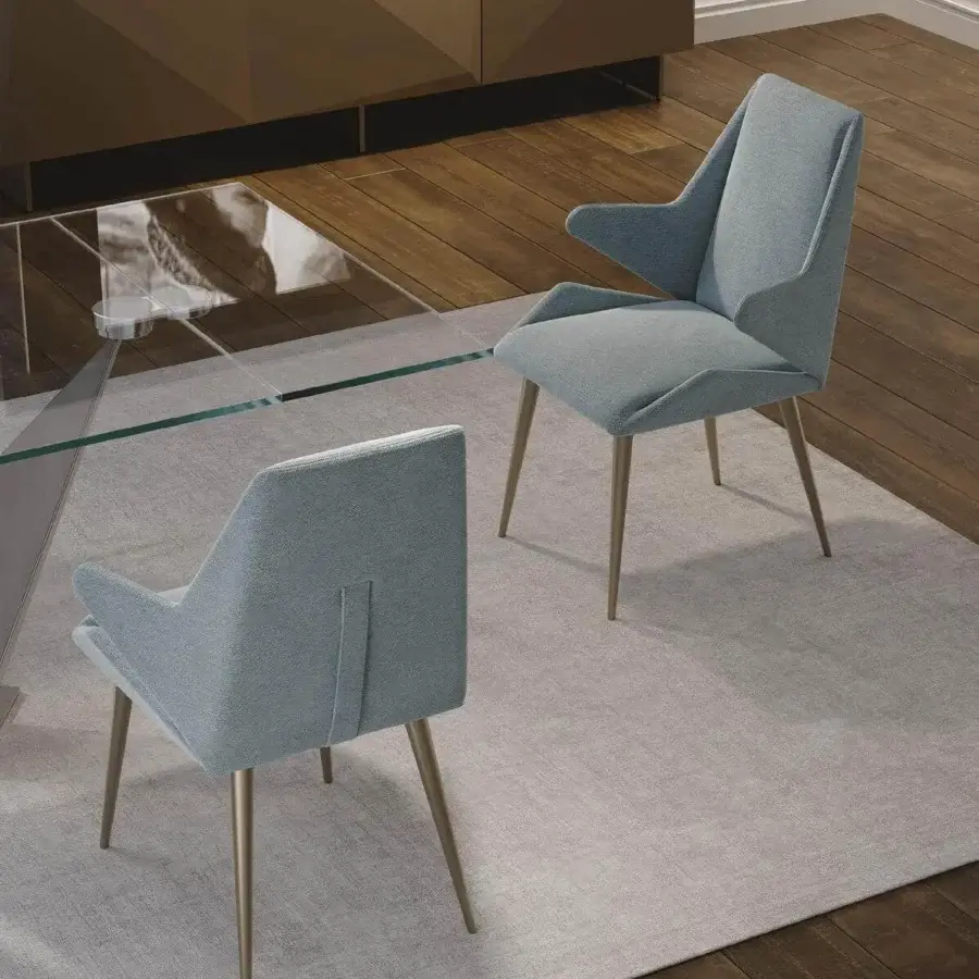 Exceptional Reflex Origami chair with faceted wood structure and brass-toned metal legs upholstered in light blue textile with a smooth finish