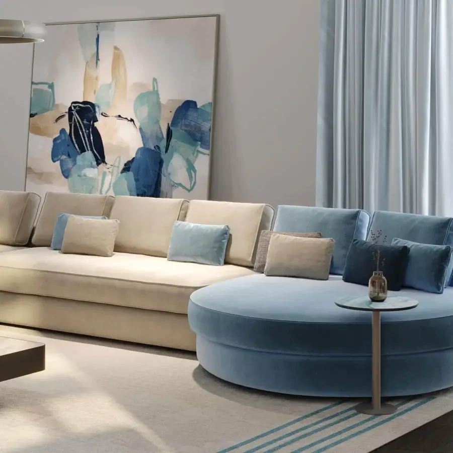 Distinguished Reflex Adone sectional with rounded forms upholstered in calming beige and blue fabrics offering exceptional comfort