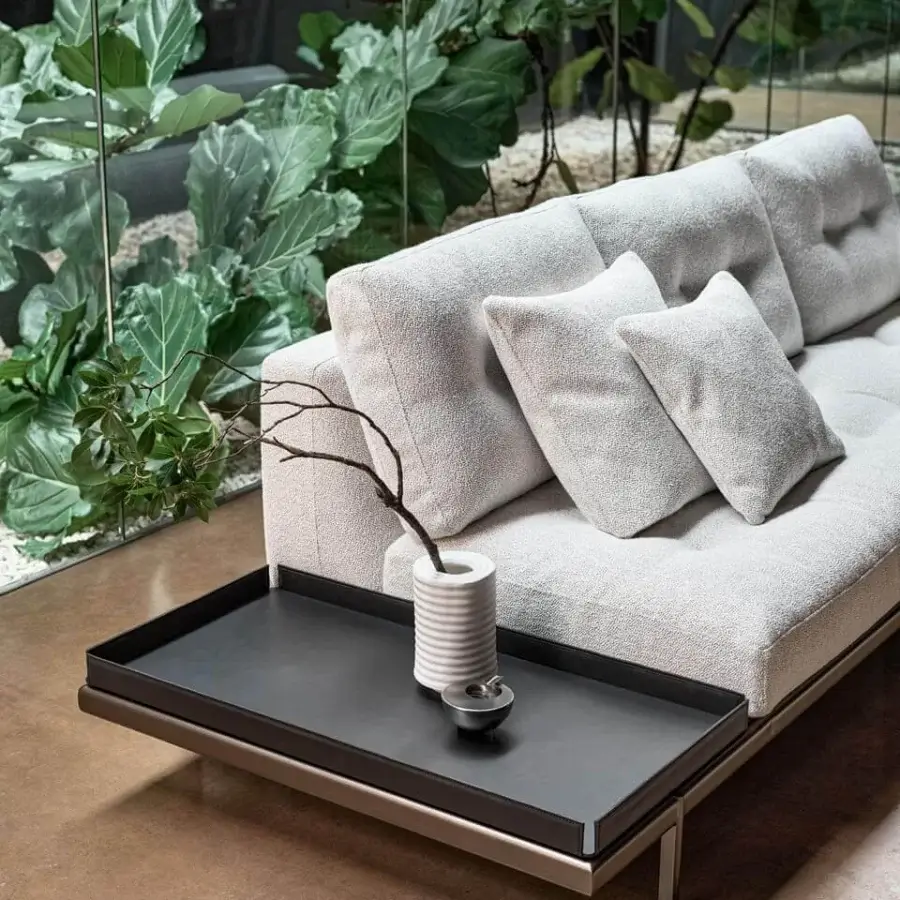 Distinguished Bonaldo Maximilian sectional with light gray textile upholstery, matt varnished metal base and attached dark side table