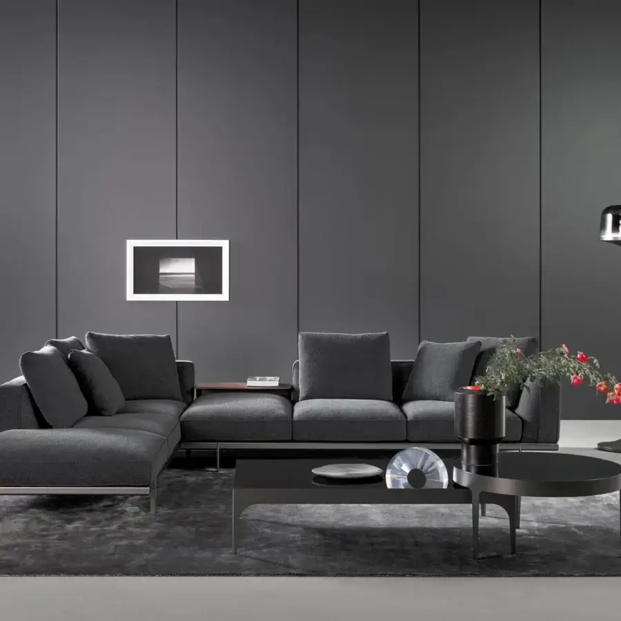 Exceptional Bonaldo Phil sectional with dark gray textile upholstery, oval tubing metal base and wood side table