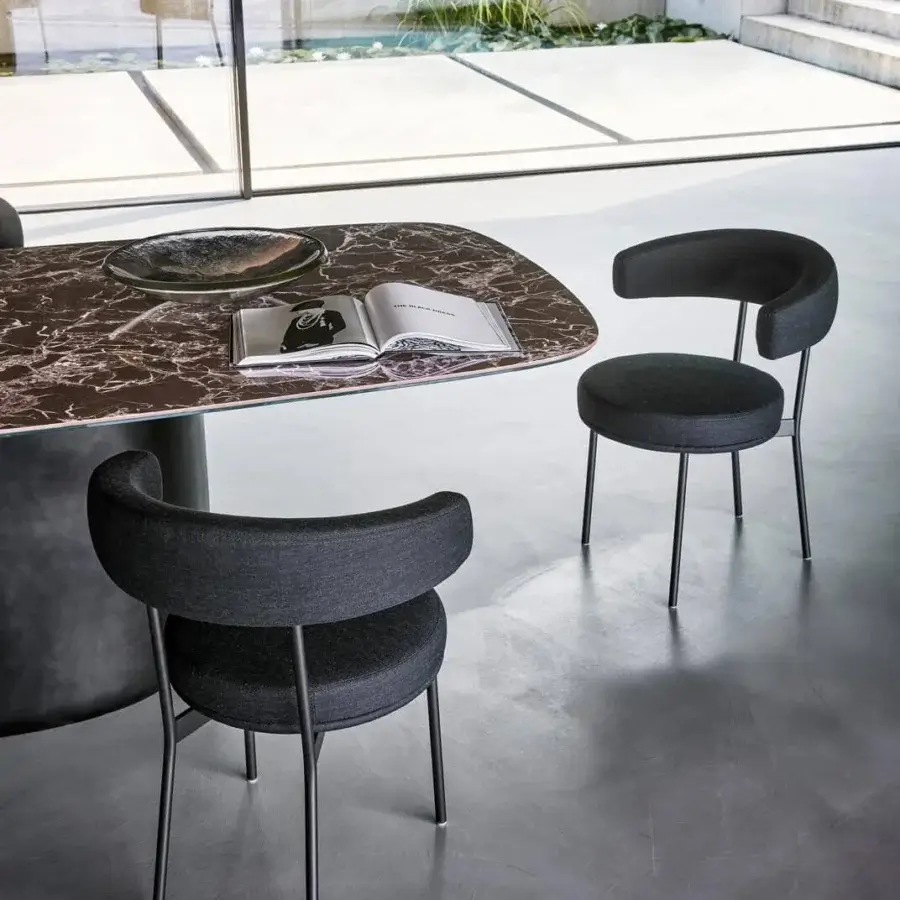 Elegant Bonaldo Neuilly armchair with rounded dark gray textile upholstery and black-finished metal structure