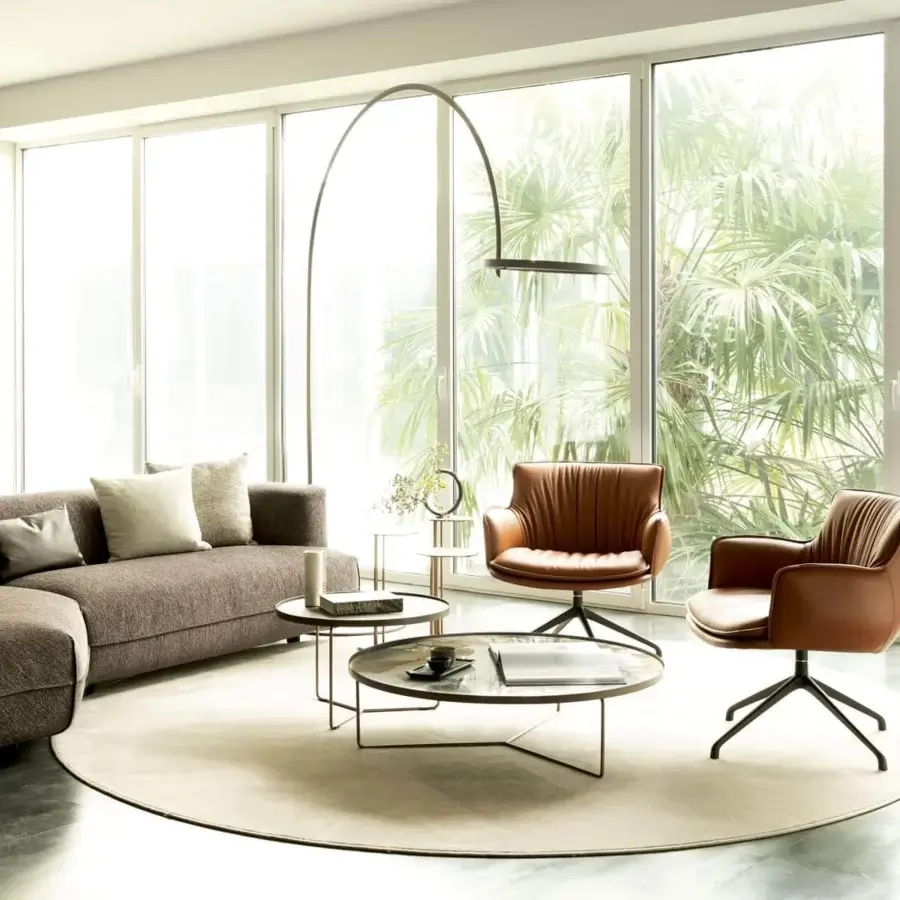 Exceptional Cattelan Italia Rhonda lounge chair with warm brown textile upholstery and black metal swivel base