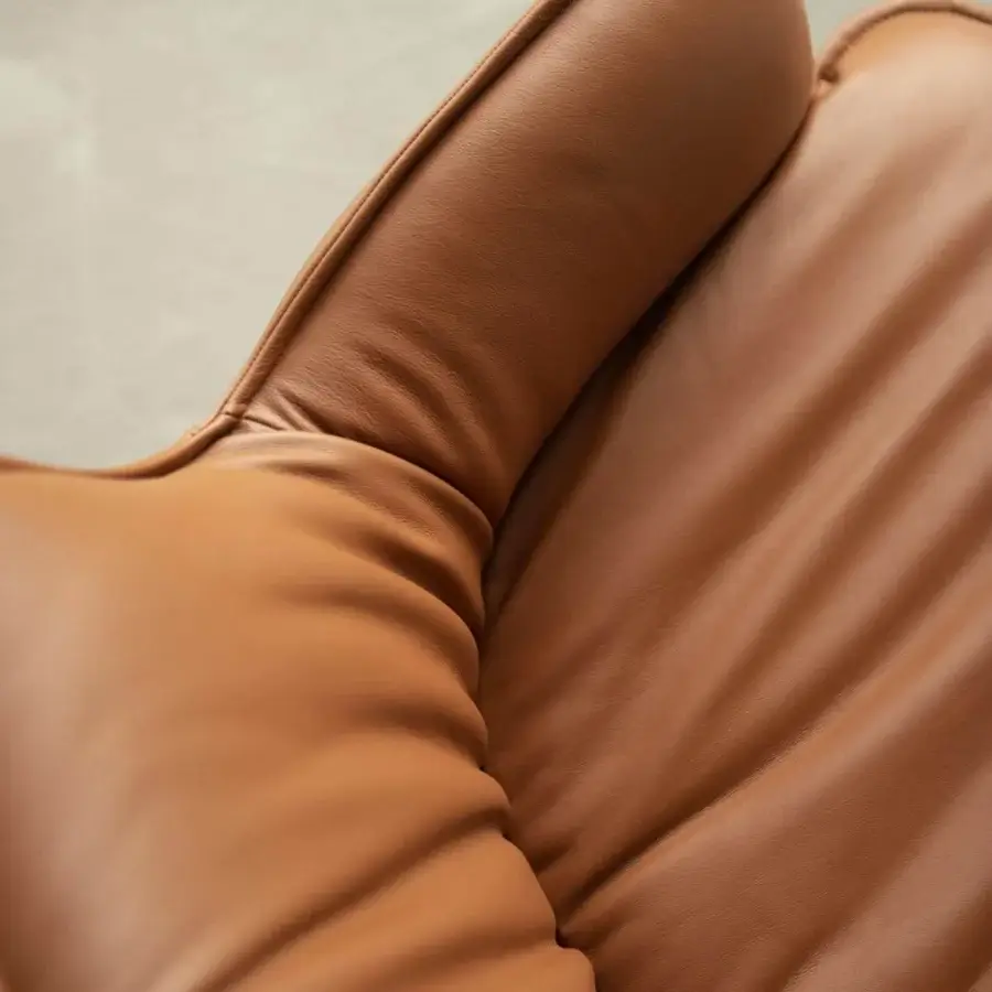 Distinguished Cattelan Italia Rhonda lounge chair upholstered in smooth tan leather with a swiveling base or metal legs