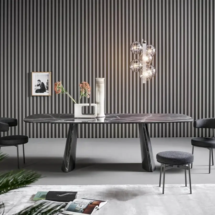 Innovative Bonaldo Torii table with dark marbled ceramic top and inclined metal base crafted with matching inserts