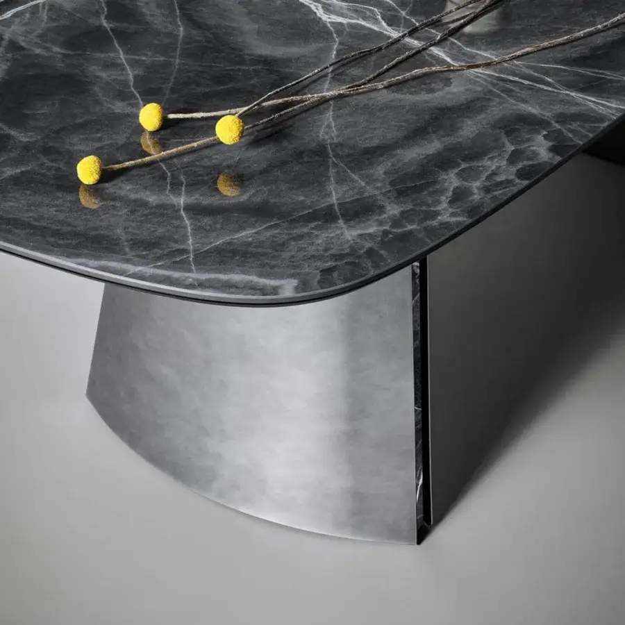 Superior Bonaldo Torii table with dark marbled ceramic top and curved metal base crafted with glossy finish