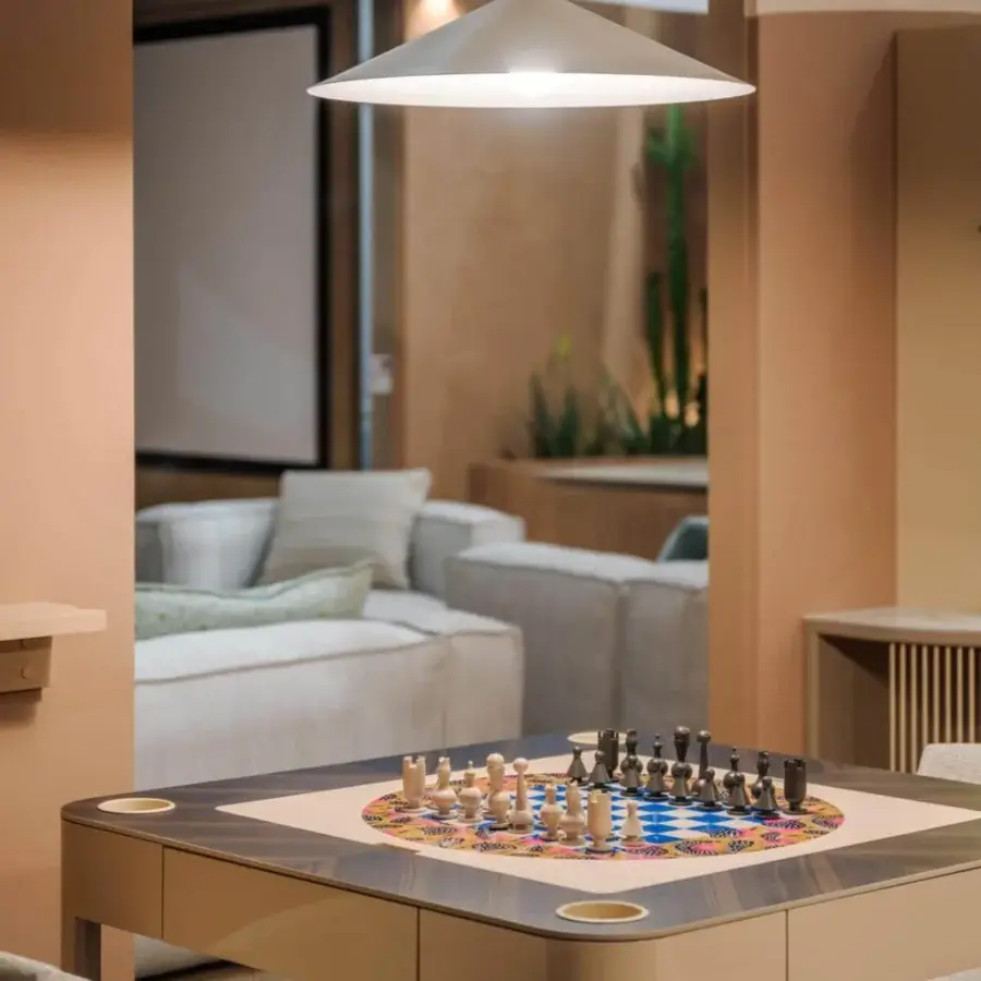 Elegant Vismara Enigma multi-game table with veneered wood rails, built-in cup holders and inlaid chess board in light tan back-lacquered glass