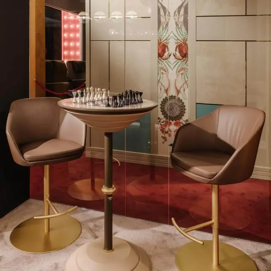 Distinguished Vismara Edgar stool with light brown leather upholstery and glossy golden steel base