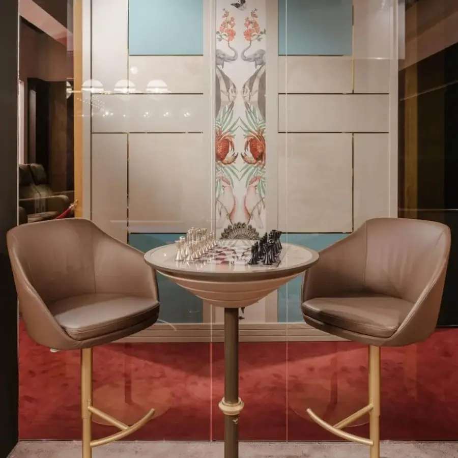 Exceptional Vismara Edgar stool with medium brown leather-like upholstery and lustrous gold-colored steel base