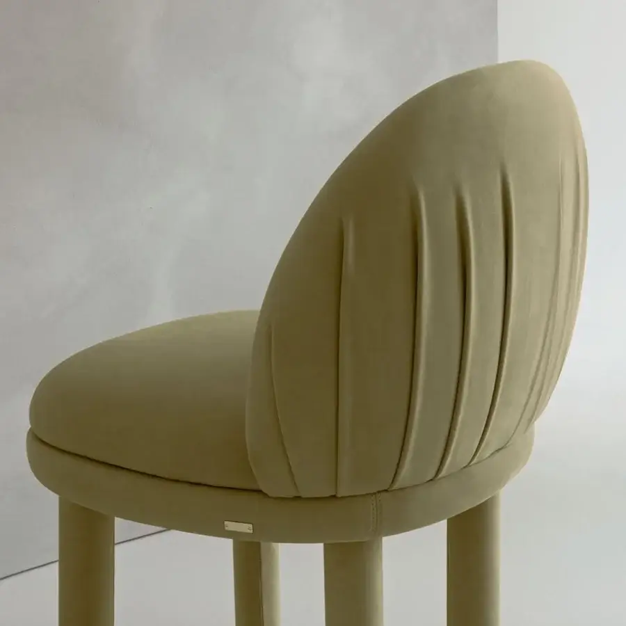 Exceptional Rugiano Fandango chair with soft lines and muted yellow leather upholstery, showcasing refined folds