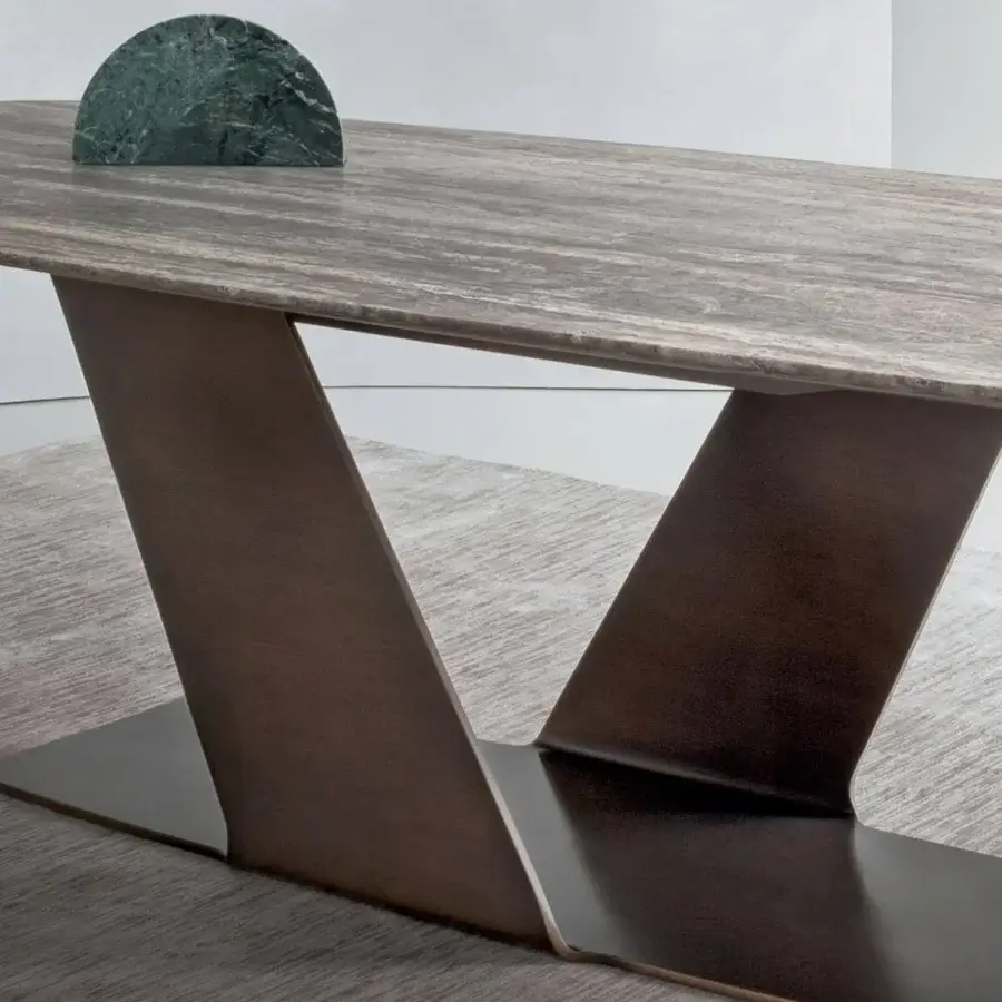 Distinguished Rugiano Wally table with varnished bronze base and grey stone-like surface exhibiting darker striations in matte finish