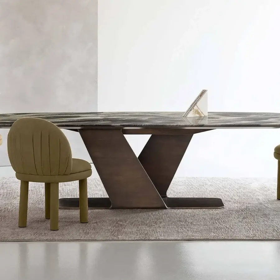 Exceptional Rugiano Wally table crafted in Italy with a marble top and varnished bronze, sculpturesque metal base