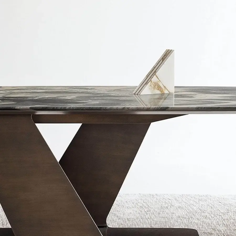Distinguished Rugiano Wally table crafted in Italy with a decorated painted wood top and varnished bronze metal base