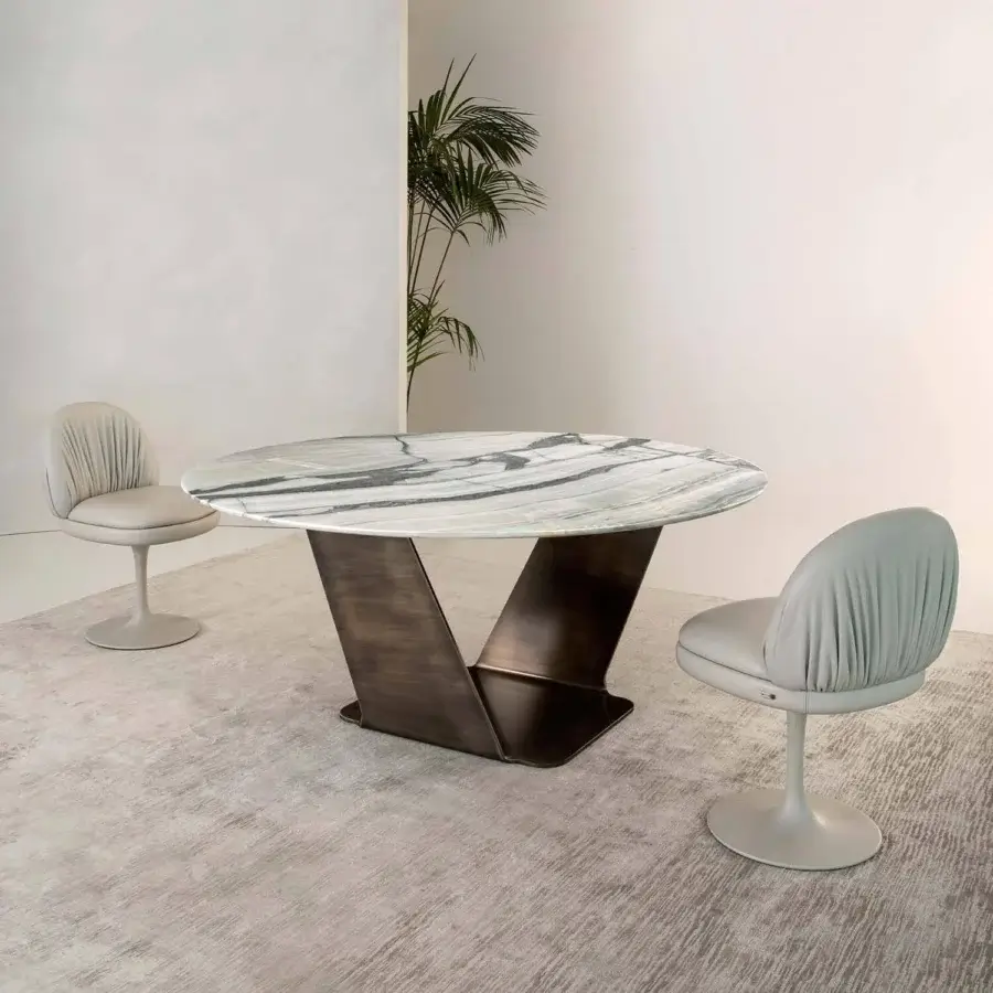 Elegant Rugiano Wally table with grey and white marble-like top and varnished bronze, sculpturesque metal base crafted in Italy